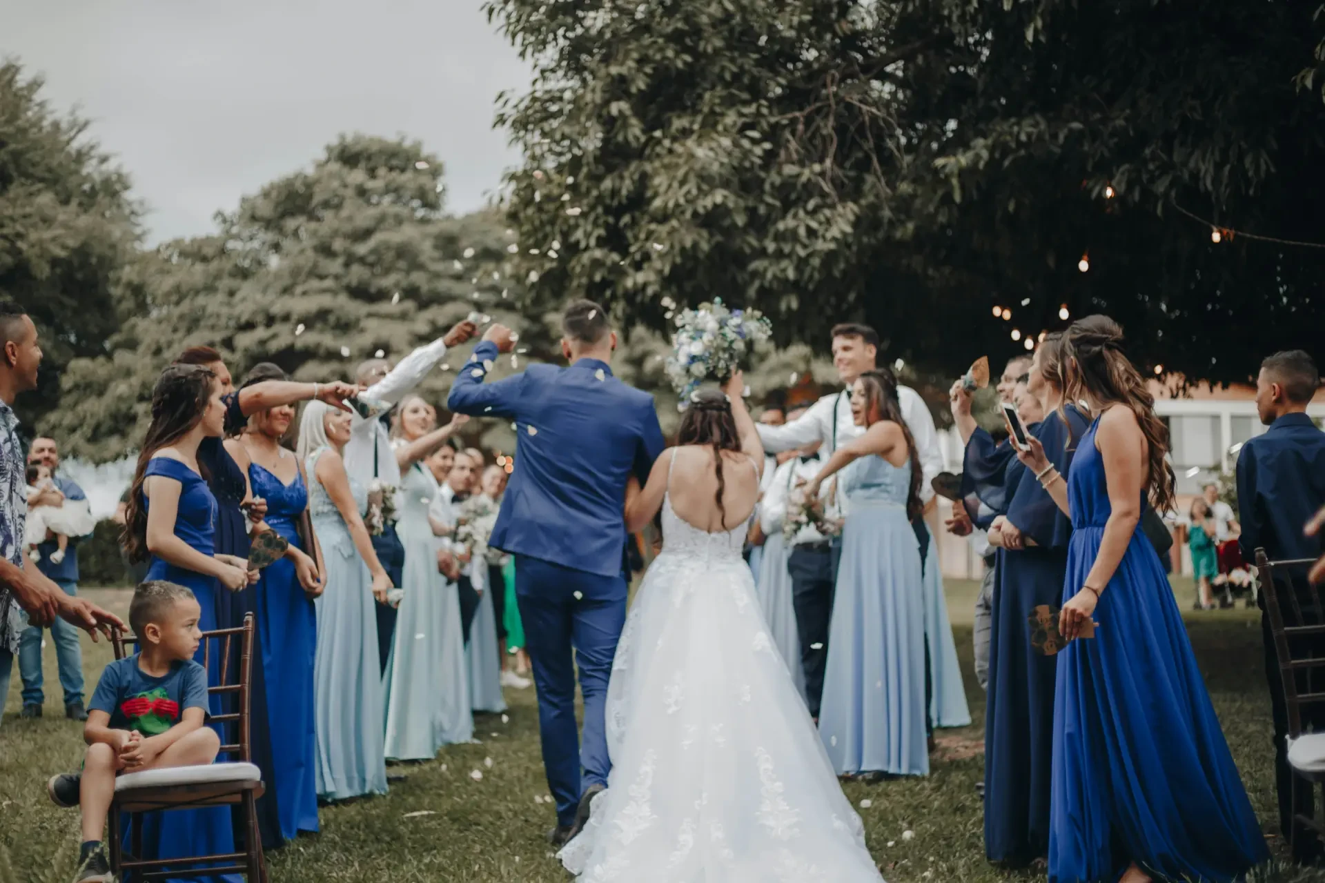 Couple dancing under string lights at wedding reception
